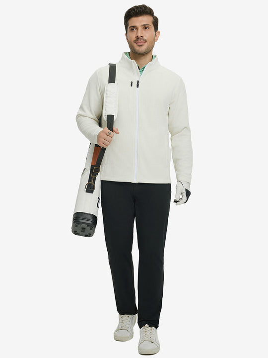 Full body shot, model carrying golf bag in textured insulated winter jacket, active outdoor style, beige.