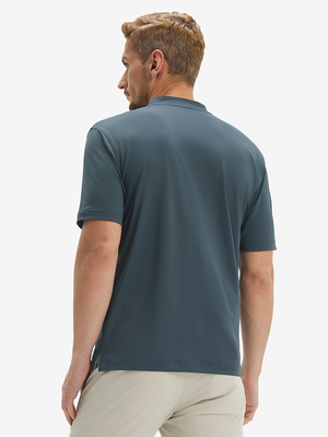 Side-back half-body view of model in dark grey moisture-wicking short sleeve henley shirt