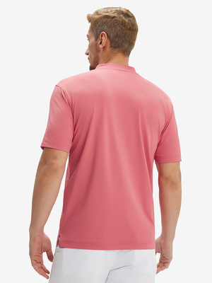 Side-back half-body view of model in brick red  moisture-wicking short sleeve henley shirt