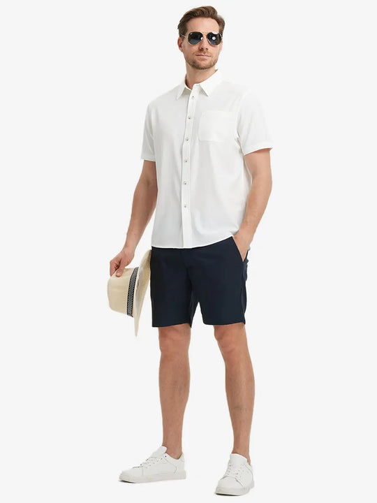 Detail shot with model holding a cap, featuring the BEIGE polo’s side vent.