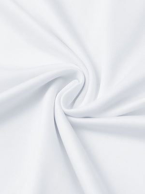 Close-up of white everyday solid jersey polo fabric showing soft knit texture and smooth surface.